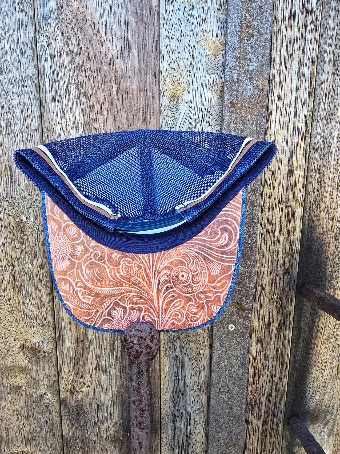 Denim with underbrim embossed patterning