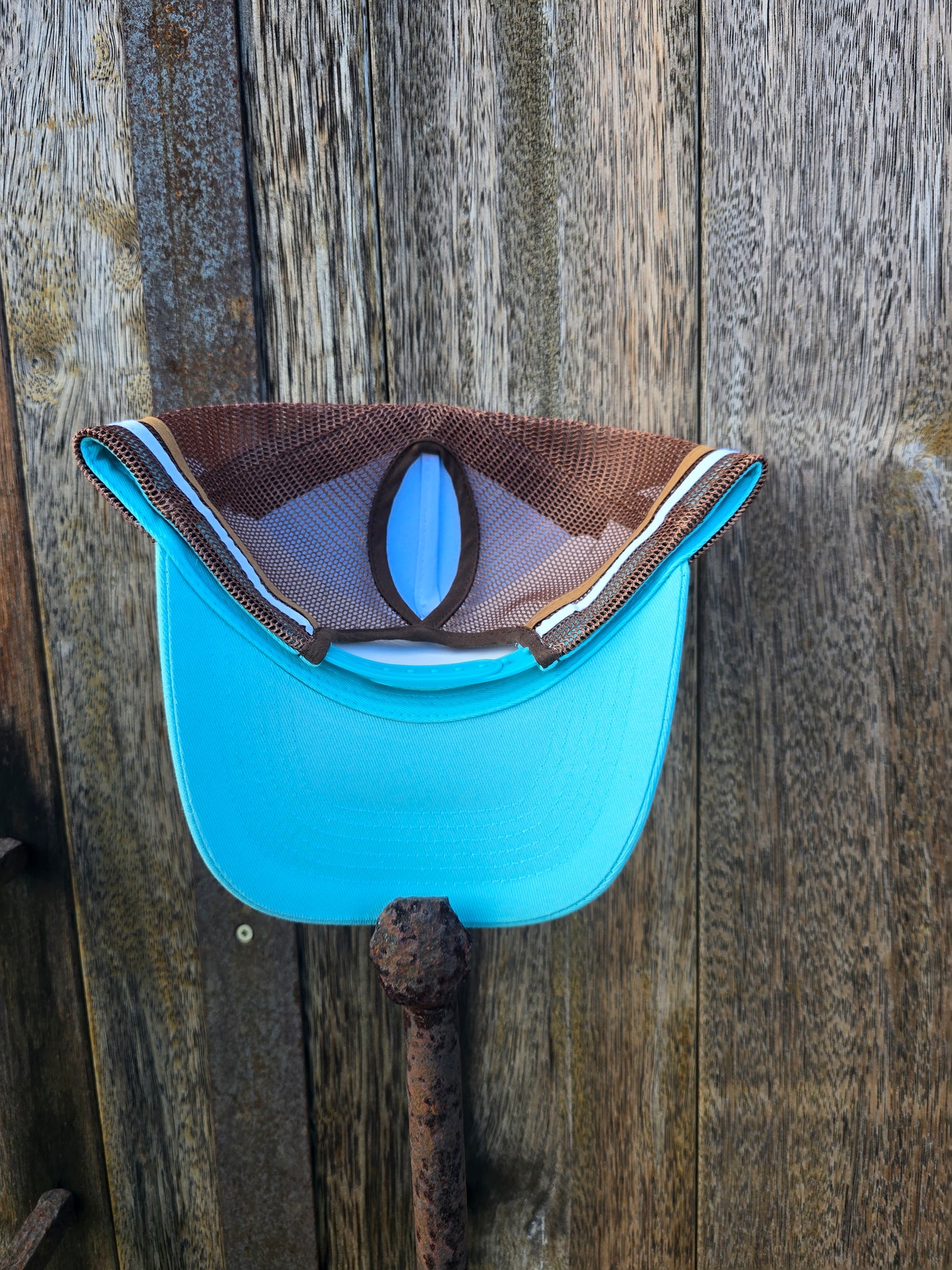 Light blue on brown ponytail cap