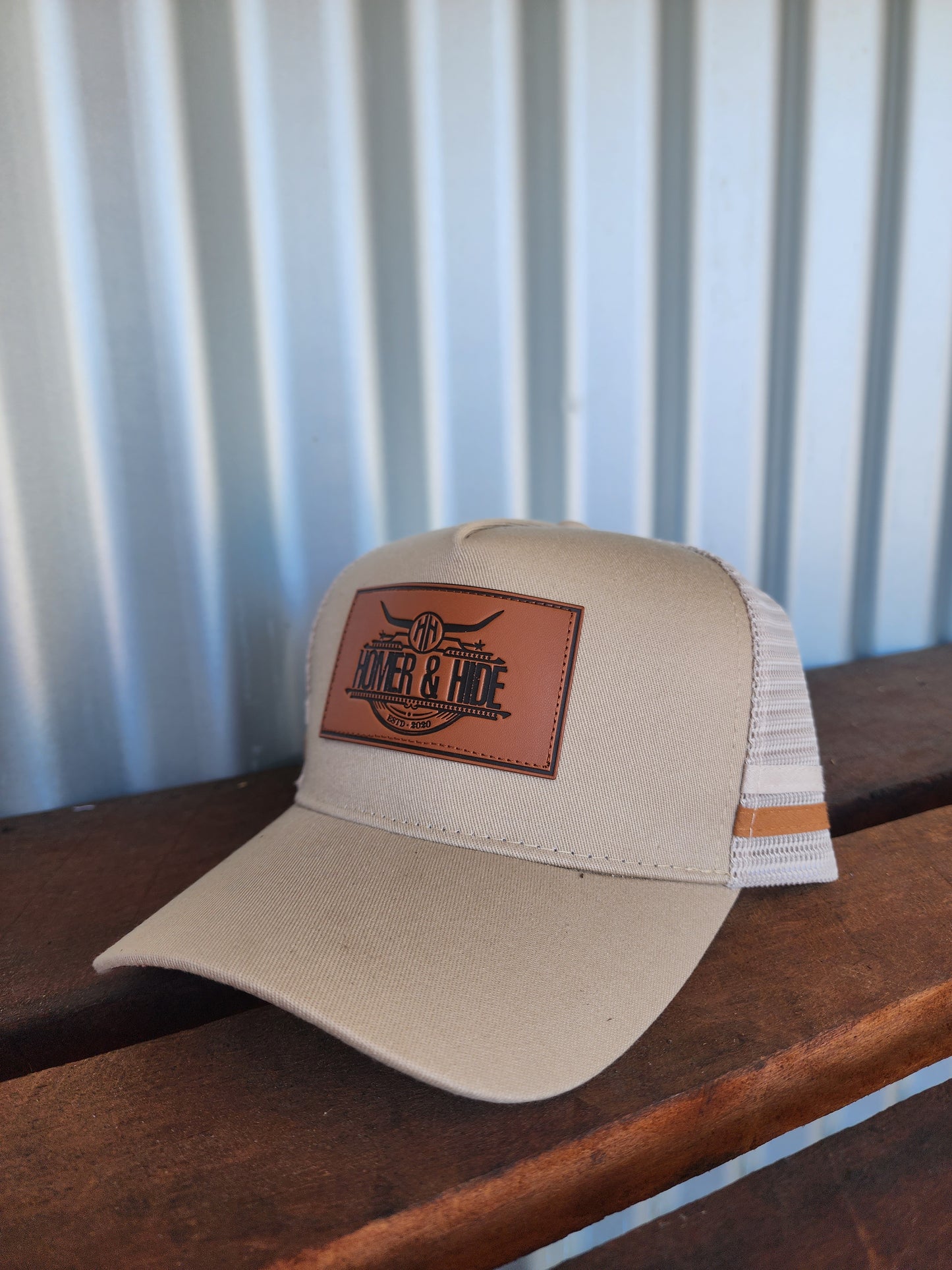 Tan with imitation embossed pattern under brim. (Patch)