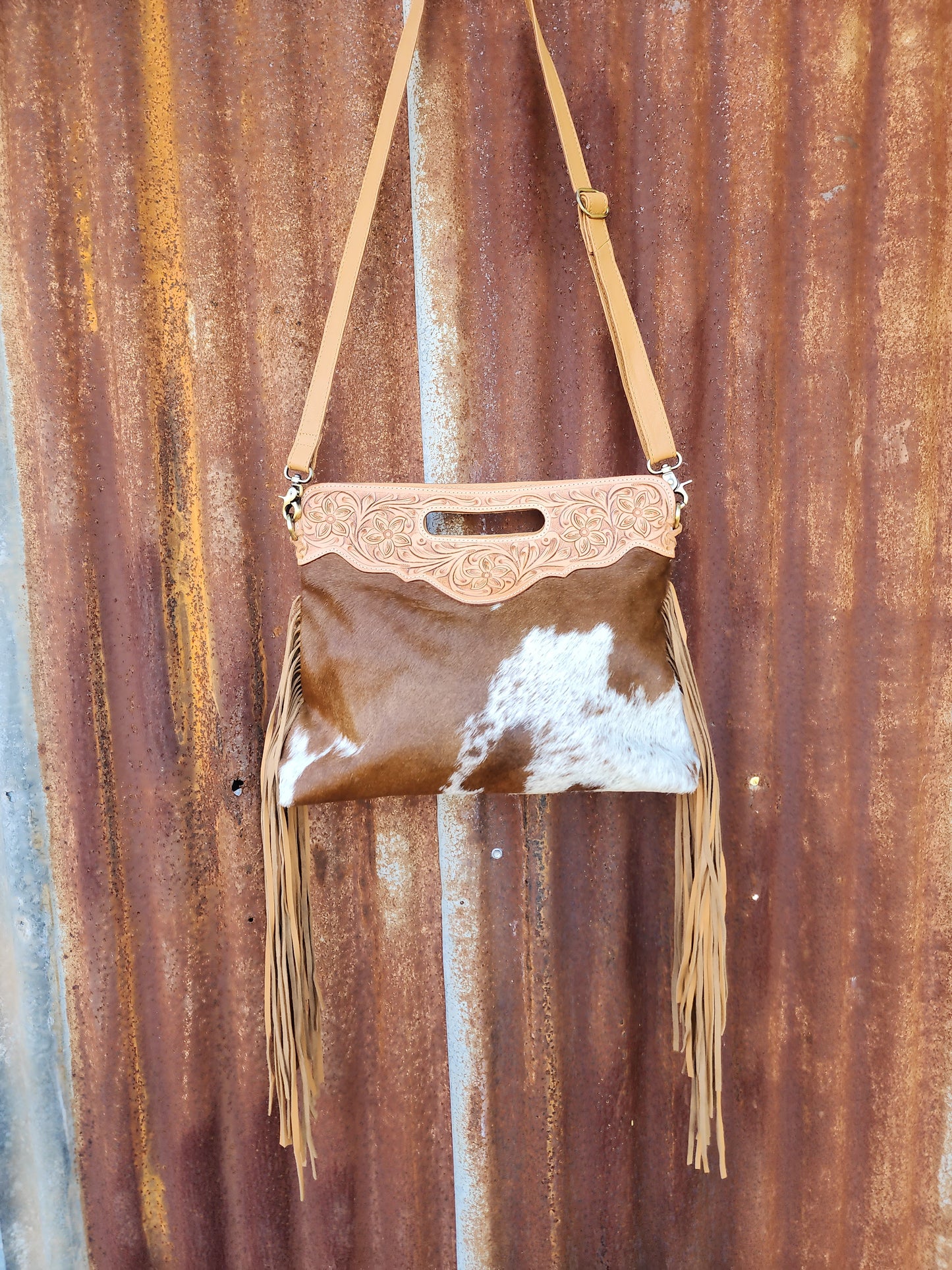 Large Tooled Tan and white tassled bag.