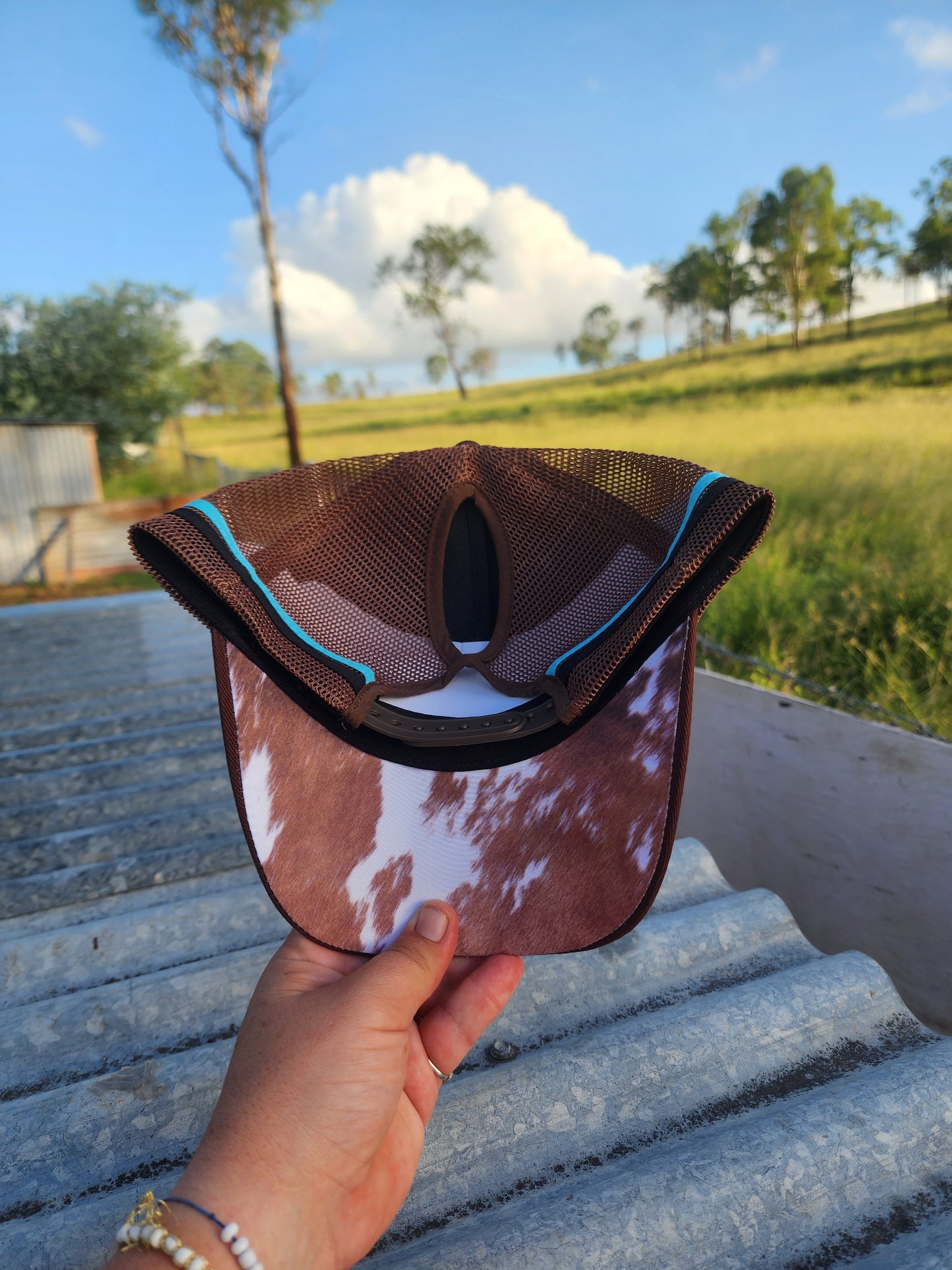 Brown with imitation cowhide print under brim pony cap (embroided)