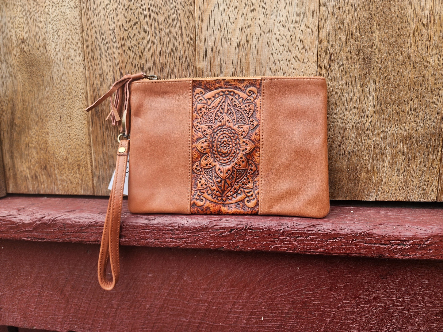 Tooled leather clutch