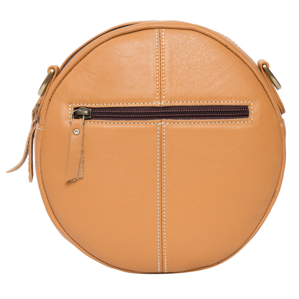 Round Tan and white tooled hand bag