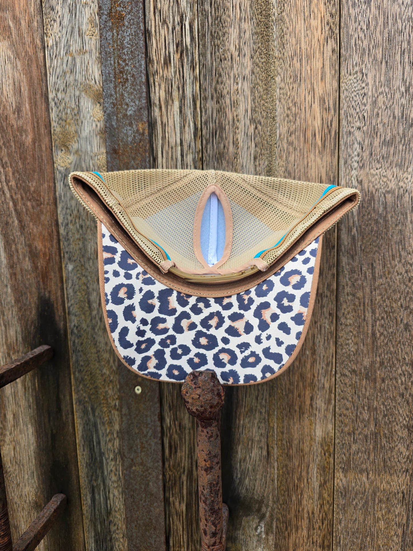 Teal brown leopard print under brim
