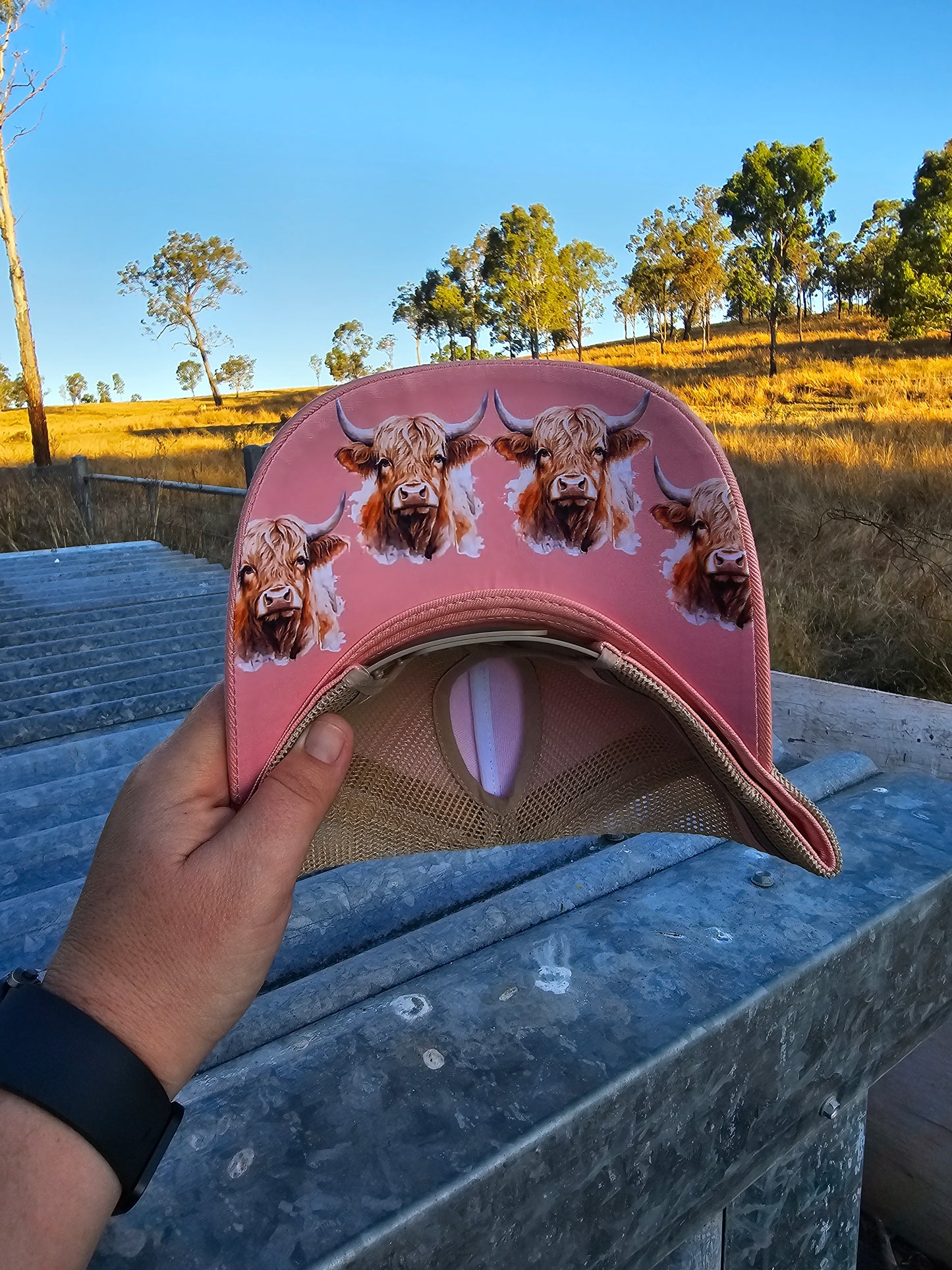 Pink on stone highland cow under brim pony cap (embroiderd)